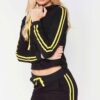 Cropped tracksuit in soft-touch knit fabric. Side stripe detail. Sporty-casual style with clean stitching, hints of vibrant c