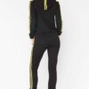 Cropped tracksuit in soft-touch knit fabric. Side stripe detail. Sporty-casual style with clean stitching, hints of vibrant c