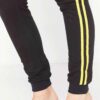 Cropped tracksuit in soft-touch knit fabric. Side stripe detail. Sporty-casual style with clean stitching, hints of vibrant c