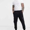 Slim-fit tee with a bold chest graphic and textured mesh stripes. Black & grey hues, visible fine stitching detail. Breathabl