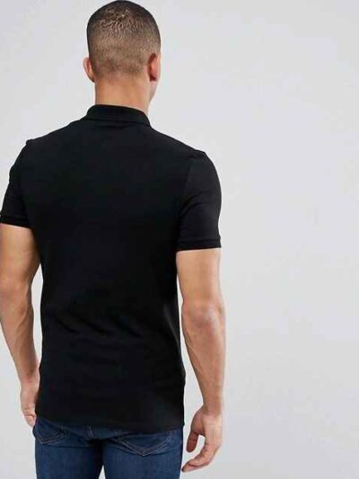 Close-up of a soft cotton polo shirt; subtle pique texture, neat stitching. Perfect casual wear, shown in a light, neutral co