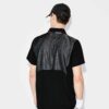Close-up of a custom tennis polo. Fine pique knit texture, clean stitching, vibrant color, tailored fit. A sporty, refined ga