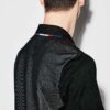 Close-up of a custom tennis polo. Fine pique knit texture, clean stitching, vibrant color, tailored fit. A sporty, refined ga