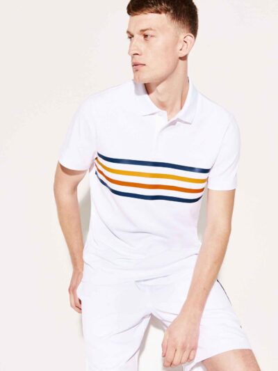 Close-up of a textured cotton polo shirt with visible breathable weave and reinforced stitching. Sportswear in a subtle shade