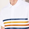 Close-up of a textured cotton polo shirt with visible breathable weave and reinforced stitching. Sportswear in a subtle shade