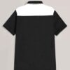 Close-up of a polo shirt featuring striped collar & cuffs, chevron pattern detail. Soft textured fabric, quality stitching ap