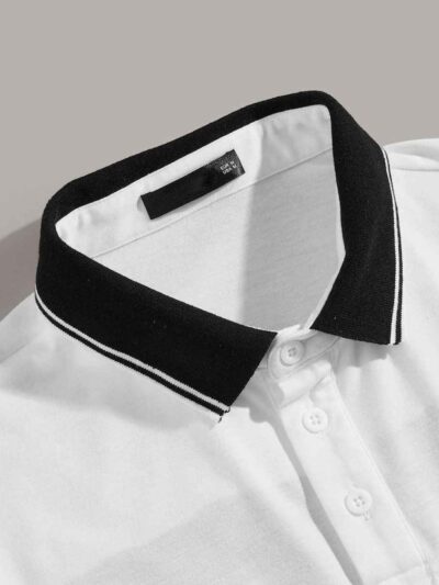 Close-up of a polo shirt featuring striped collar & cuffs, chevron pattern detail. Soft textured fabric, quality stitching ap