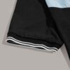 Close-up of a polo shirt featuring striped collar & cuffs, chevron pattern detail. Soft textured fabric, quality stitching ap