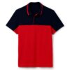 Close-up of a polo shirt with stylish color blocking and a prominent neck label. Textured fabric with visible, quality stitch