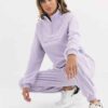 Cozy fleece tracksuit. Half-zip sweat top and basic joggers in a neutral hue. Note the premium stitching and heavy-weight fab