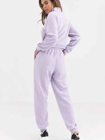 Cozy fleece tracksuit. Half-zip sweat top and basic joggers in a neutral hue. Note the premium stitching and heavy-weight fab