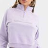 Cozy fleece tracksuit. Half-zip sweat top and basic joggers in a neutral hue. Note the premium stitching and heavy-weight fab