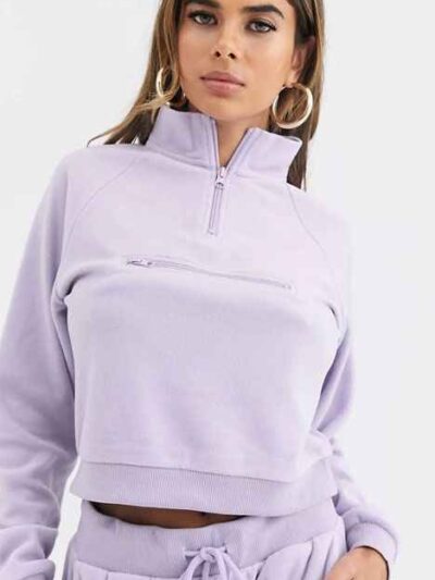 Cozy fleece tracksuit. Half-zip sweat top and basic joggers in a neutral hue. Note the premium stitching and heavy-weight fab