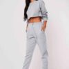 Girls crop sweatsuit, light fabric. Ruff hem, sexy style. Custom, high-quality stitching detail. Perfect streetwear or lounge