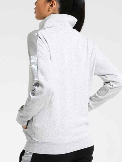 Women's two-piece tracksuit. Zipper hooded top, matching pants. Soft-look fabric, subtle stitching detail. Casual athletic we