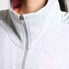 Women's two-piece tracksuit. Zipper hooded top, matching pants. Soft-look fabric, subtle stitching detail. Casual athletic we