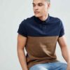 Close-up of embroidered polo shirt, fine pique knit texture. Royal blue fabric, crisp white logo stitching. Professional staf