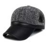 Ear flap baseball cap: PU leather visor, woolen striped panels. Folded ear flaps show stitching. Unisex style, warm fabric. -