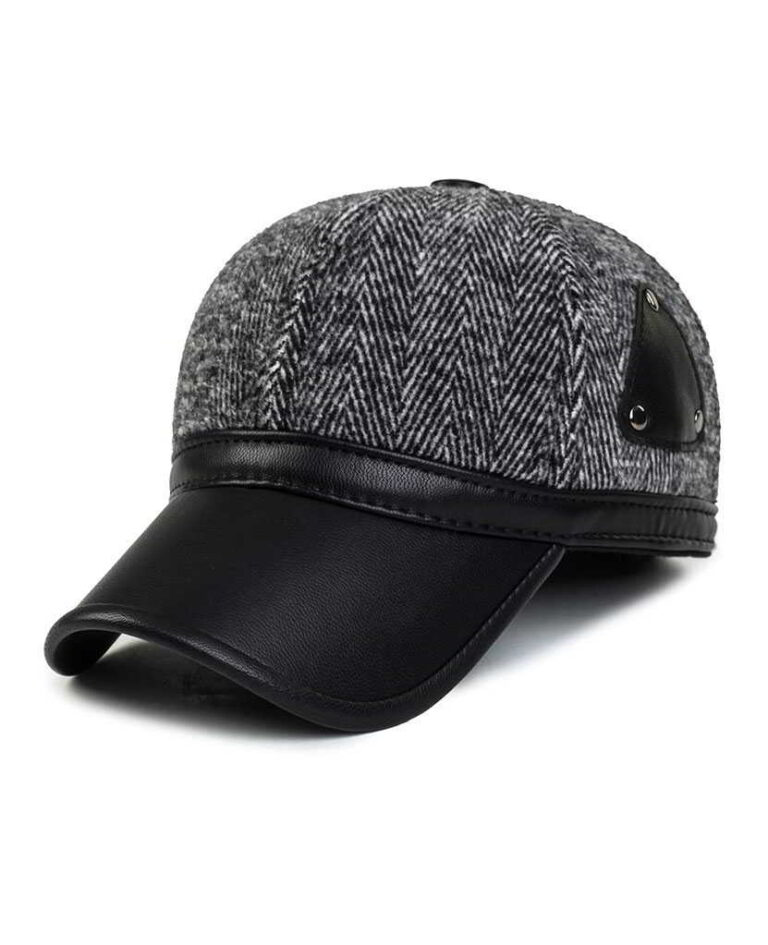 Ear flap baseball cap: PU leather visor, woolen striped panels. Folded ear flaps show stitching. Unisex style, warm fabric. -