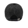 Ear flap baseball cap: PU leather visor, woolen striped panels. Folded ear flaps show stitching. Unisex style, warm fabric. -