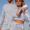Crop hoodie tracksuit: contrast panels highlight the sporty silhouette. Soft, brushed fleece texture; neat stitching. Activew