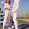 Crop hoodie tracksuit: contrast panels highlight the sporty silhouette. Soft, brushed fleece texture; neat stitching. Activew