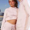 Crop hoodie tracksuit: contrast panels highlight the sporty silhouette. Soft, brushed fleece texture; neat stitching. Activew