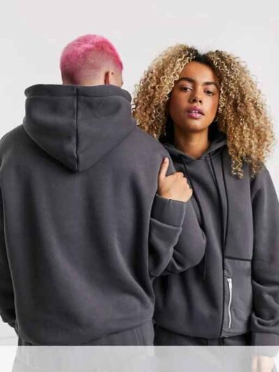 Heather grey unisex hoodie with durable nylon pocket, subtle stitch detailing. Soft, comfortable fleece fabric. Perfect casua