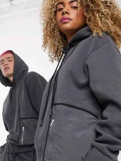 Heather grey unisex hoodie with durable nylon pocket, subtle stitch detailing. Soft, comfortable fleece fabric. Perfect casua