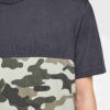 Men's short-sleeve shirt. Textured fabric, visible stitching. Casual style, custom print area, dark gray with light accents.