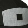 Black skull cap for motorcycle riders, hook and loop badge area on front. Breathable material, clean stitching detail. - View