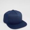 Close-up of a vintage corduroy baseball cap. Notice the soft, ridged texture, embroidered logo, and durable stitching. A casu