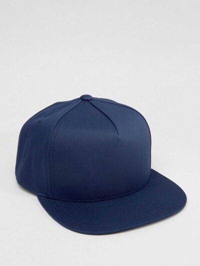 Close-up of a vintage corduroy baseball cap. Notice the soft, ridged texture, embroidered logo, and durable stitching. A casu