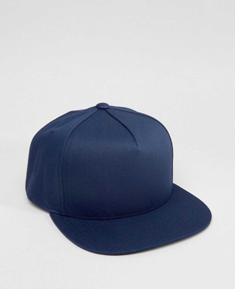 Close-up of a vintage corduroy baseball cap. Notice the soft, ridged texture, embroidered logo, and durable stitching. A casu