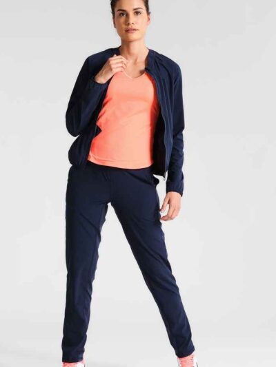 Ladies' vibrant two-piece tracksuit. Soft, stretchy fabric, maybe fleece. Figure-hugging fit, athletic-inspired stitching det