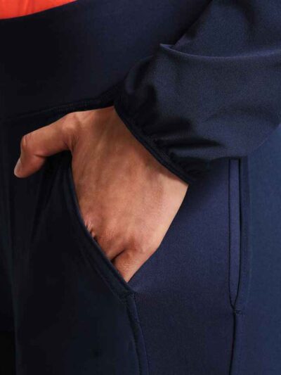 Ladies' vibrant two-piece tracksuit. Soft, stretchy fabric, maybe fleece. Figure-hugging fit, athletic-inspired stitching det