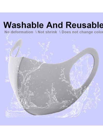 Grey fabric face covering with neat stitching, breathable material. Reusable dust barrier mask for adults, comfortable fit.