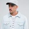 Khaki fishing hat with sturdy chin strap. Waterproof, breathable fabric shows fine stitching and adjustable toggles. Protect