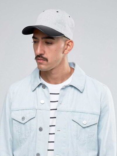 Khaki fishing hat with sturdy chin strap. Waterproof, breathable fabric shows fine stitching and adjustable toggles. Protect