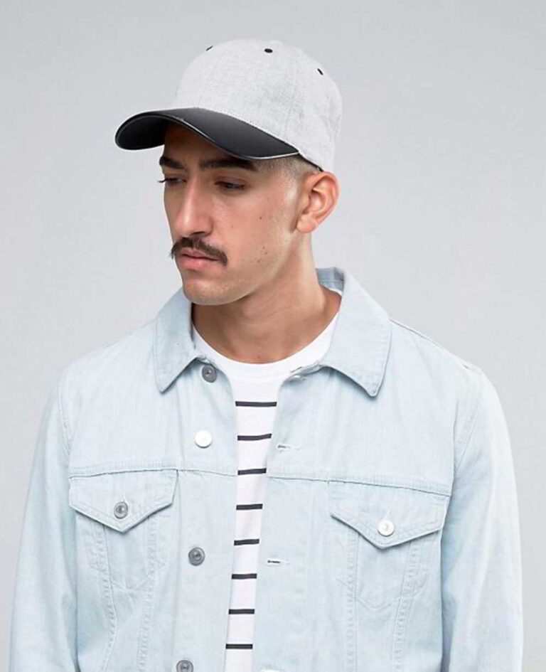 Khaki fishing hat with sturdy chin strap. Waterproof, breathable fabric shows fine stitching and adjustable toggles. Protect