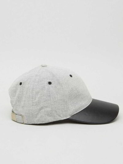 Khaki fishing hat with sturdy chin strap. Waterproof, breathable fabric shows fine stitching and adjustable toggles. Protect