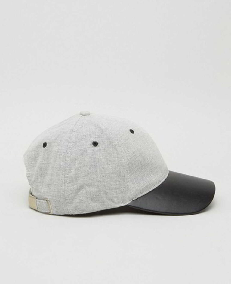 Khaki fishing hat with sturdy chin strap. Waterproof, breathable fabric shows fine stitching and adjustable toggles. Protect