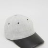 Khaki fishing hat with sturdy chin strap. Waterproof, breathable fabric shows fine stitching and adjustable toggles. Protect