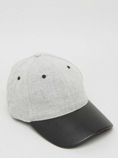 Khaki fishing hat with sturdy chin strap. Waterproof, breathable fabric shows fine stitching and adjustable toggles. Protect