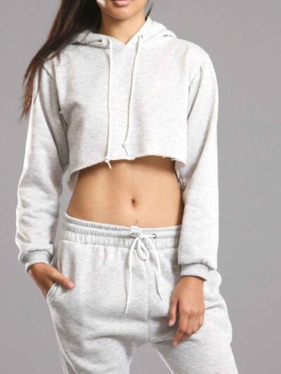 White cotton girls' sweatsuit. Soft, looped interior. Ribbed cuffs & hem. Comfortable fit, visible stitching detail. Sporty &