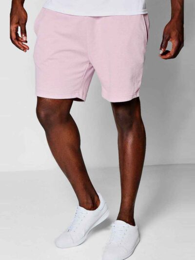 Close-up of breathable training shorts. Lightweight, textured fabric. Reinforced stitching for durability. Ideal for active w