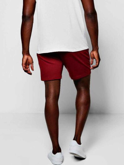Close-up of breathable training shorts. Lightweight, textured fabric. Reinforced stitching for durability. Ideal for active w