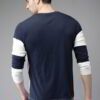 Close-up: Light blue breathable t-shirt. Fine, tight-knit fabric texture. Clean stitching. Short-sleeve crew neck. Evokes coo