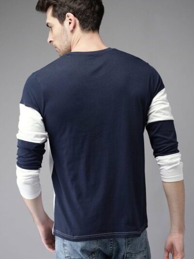 Close-up: Light blue breathable t-shirt. Fine, tight-knit fabric texture. Clean stitching. Short-sleeve crew neck. Evokes coo