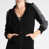 Custom embroidered tracksuits. Soft-brushed fleece interior, durable outer. Detailed stitching on chest & sleeve. Sporty runn